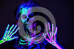 Skeleton bodyart with blacklight photo