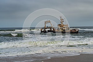 Skeleton Coast in Namibia. The shipwreck was stranded or grounded at the coastline