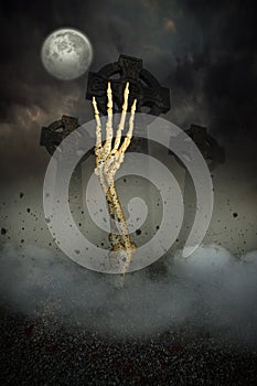 Skeleton hand bursting from the grave