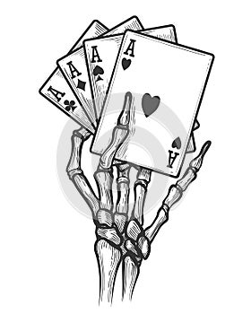 Skeleton hand with four aces photo