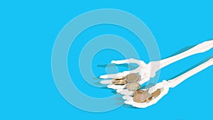 Skeleton hands holding coins money. Light blue background. Copy space. Minimal concept