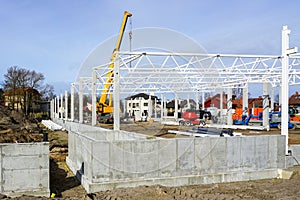 Skeleton of metal building under construction, industrial object