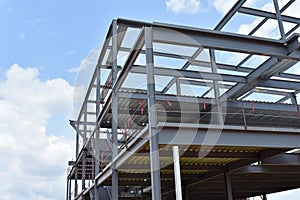 Skeleton of metal building under construction is shown