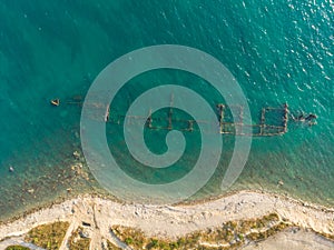 Skeleton of the seagoing ship on the shallow water