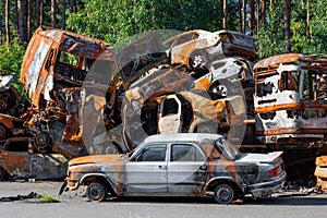 Skeletons of burned cars piled up after the expulsion of Russian invaders near the city of Irpen near Kyiv