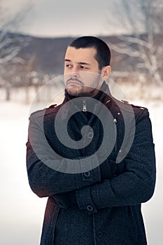 Skeptical Man Outside in Snowing Winter Decor