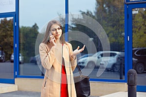 Skeptical, unhappy, serious woman talking on phone