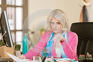 Skeptical Woman at Her Desk