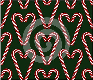 Sketch hand drawn pattern of red and white candy cane in heart shape isolated on green background.