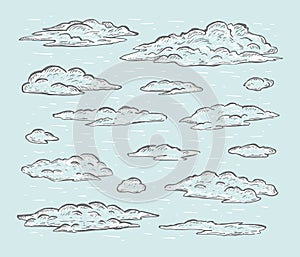 Sketch set of hand drawn clouds isolated on blue background