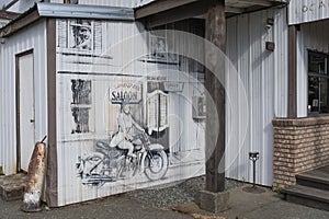 Some black-and-white sketches on the wall of the Highwayman saloon in Union Bay, BC