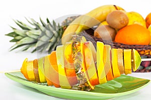 Skewer with slices of tropical fruit