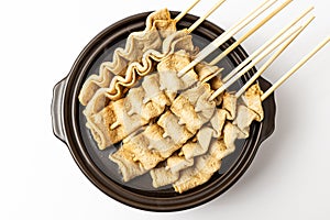 Skewered fish cake on white background