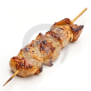Skewered grilled chicken isolated on white background photo