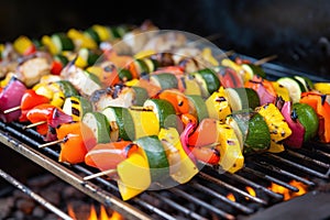 skewered vegetable kabobs roasting on rotisserie grill