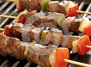 Skewers of meat on the grill