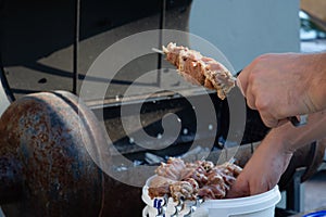 Skewers on skewers. Grilled kebab cooking on metal skewer