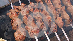 Skewers to roast on the grill, close-up. Barbecue outdoors