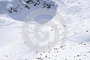Ski alpinist passing alpine valley full of snow, wide shot, Slovakia, Europe