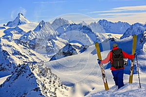 Ski with amazing view of swiss famous mountains in beautiful winter snow Mt Fort. The skituring, backcountry skiing in fresh