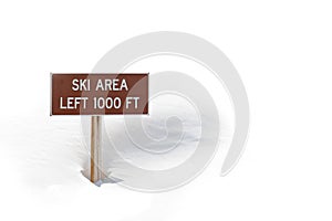 Ski area sign in snow