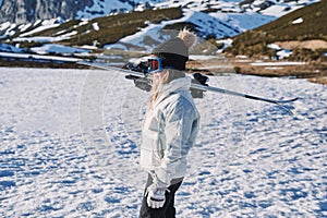 Ski carrier pretty girl ready to start skiing