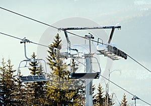 Ski chair lifts on a cable way at a large ski resort in winter