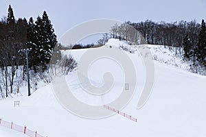 Ski field large white snow on slopes. Ski slopes snow. Winter banner panorama of slope at ski resort,