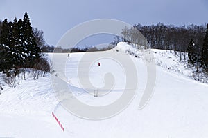 Ski field large white snow on slopes. Tourists come to play winter sports. Ski slopes snow.