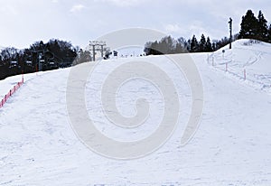 Ski field large white snow on slopes. Tourists come to play winter sports. Ski slopes snow.