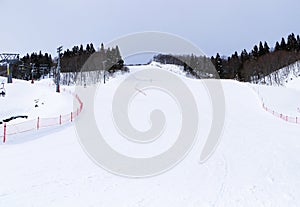 Ski field large white snow on slopes. Tourists come to play winter sports. Ski slopes snow.