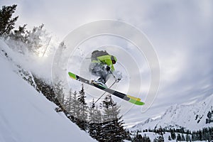 Ski freerider jumping thourgh trees
