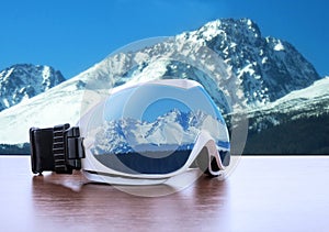 Ski glasses against mountains