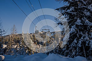 Ski gondola lift in mountains ski attraction. Mountains winter landscape view