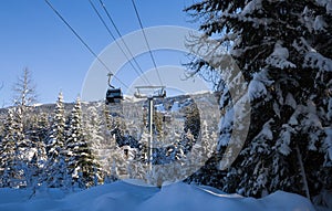 Ski gondola lift in mountains ski attraction. Mountains winter landscape view