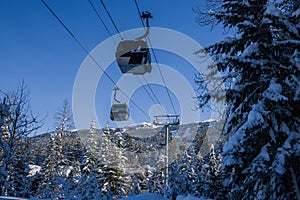 Ski gondola lift in mountains ski attraction. Mountains winter landscape view