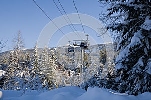 Ski gondola lift in mountains ski attraction. Mountains winter landscape view