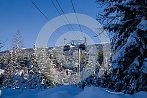 Ski gondola lift in mountains ski attraction. Mountains winter landscape view
