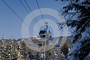 Ski gondola lift in mountains ski attraction. Mountains winter landscape view