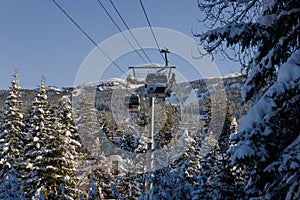 Ski gondola lift in mountains ski attraction. Mountains winter landscape view