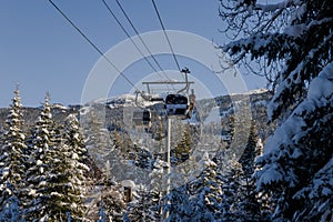 Ski gondola lift in mountains ski attraction. Mountains winter landscape view