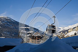 Ski gondola lift in mountains ski attraction. Mountains winter landscape view. Ski resort