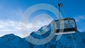 Ski Holiday - empty chairlift in high Alpine ski resort