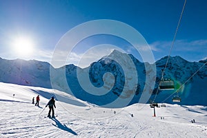 Ski holiday, sunny day in popular Alpine ski resort, Solda