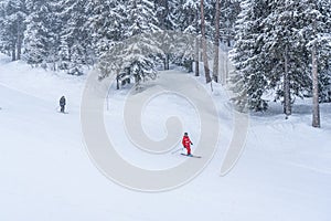 Ski instructor and skier in the french ski resort on mountain, skiing in heavy snow.