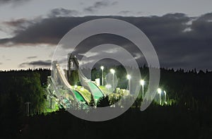 Ski jumping hills in night-time lighting