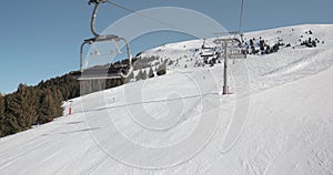 Ski lift ascent in snowy Alps