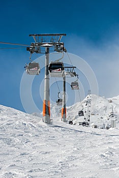 ski lift in the Austrian Alps, closed gondolas are a convenient way to get to the top