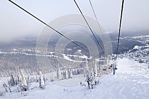 Ski lift, cable car funicular with open cabin on the background