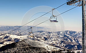 Ski lift with chairs in Kopaonik resort in Serbia